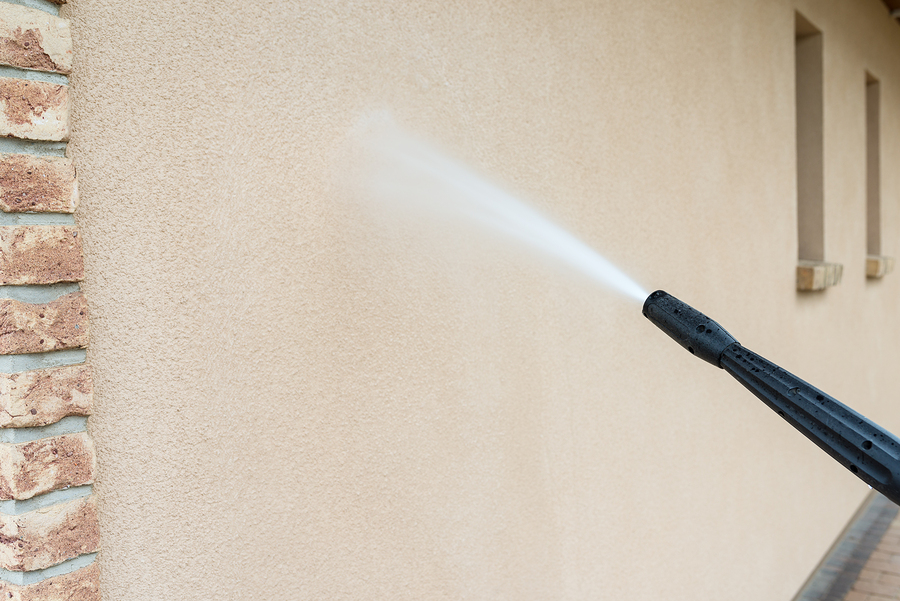 professional exterior cleaner cleaning walls